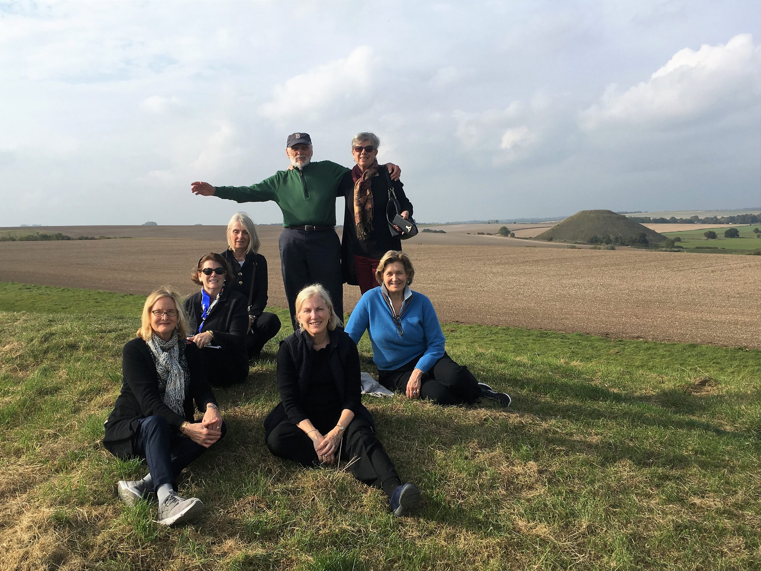 Private tour of Avebury area. On top of West Kennet Long Barrow with Silbury Hill in the background.